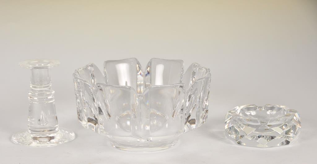 3 Pcs. Art Glass--Baccarat, Steuben, Orrefors: 1st item: Baccarat faceted crystal ashtray, signed on base, 4 1/4" diameter, 1 1/2"H, good condition---2nd item: 4 1/2"H Steuben teardrop candlestick, signed on base, good condition---3rd item: Orrefo