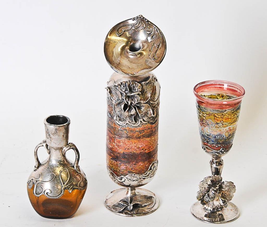 3 Art Glass Pieces w/ Silver Metal Mountings: Three hand blown art glass pieces, each with silver metal mountings--1st item: Cypriote glass vase in the style of Tiffany, applied silver metal jack-in-the-pulpit top with floral decoration in high r