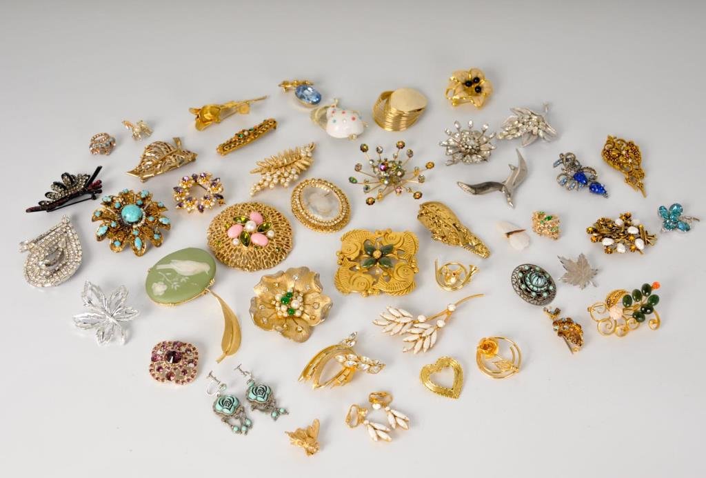 42 Vintage Brooches: Various designs and sizes, two brooches with matching earrings; marks include Kramer, Robert, Trifari, Coro, Sarah Coventry, Tancer II, Germany, BB; possible small losses