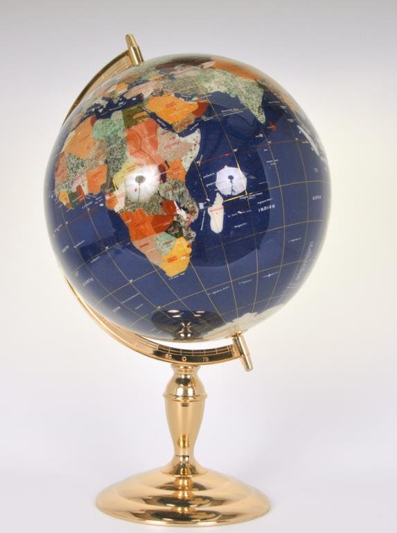 Lapis and Semi-Precious Stones World Globe: A 14" world globe with blue lapis oceans and inlaid semi-precious stones depicting countries, gilt metal stand, height with stand 21"