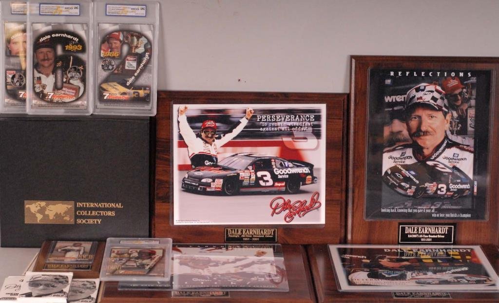 Dale Earnhardt Coins, Photographs, Trading Cards: Collection of Dale Earnhardt commemorative items: Two (2) Colorized 2001 Dale Earnhardt U.S. Silver Eagle dollars---Four (4) Colorized 2001 Dale Earnhardt North Carolina U.S. State quarters, 1986, 198