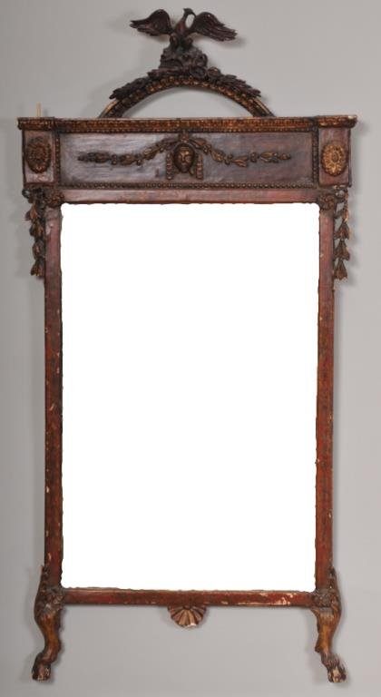 Early 19th Century Carved Mirror: Painted and gilt wood frame having an arched crest with phoenix over a carved mask with foliate swag, rosettes at top corners over ribbon and bellflower cascades, base with carved shell at center and 