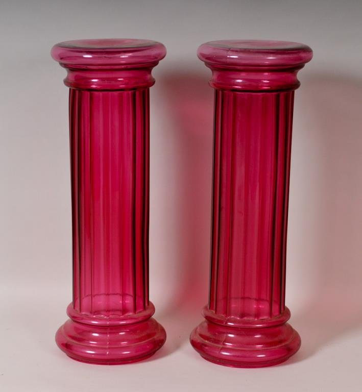 Pair of 30" Pilgrim Glass Cranberry Columns: Pair of cranberry art glass floor pedestals or vases (one end is open); from the Masterwork collection by Pilgrim Glass Company, Huntington, West Virginia; c. 1985; 30 1/4"H, 10 3/4" dia.; good condit