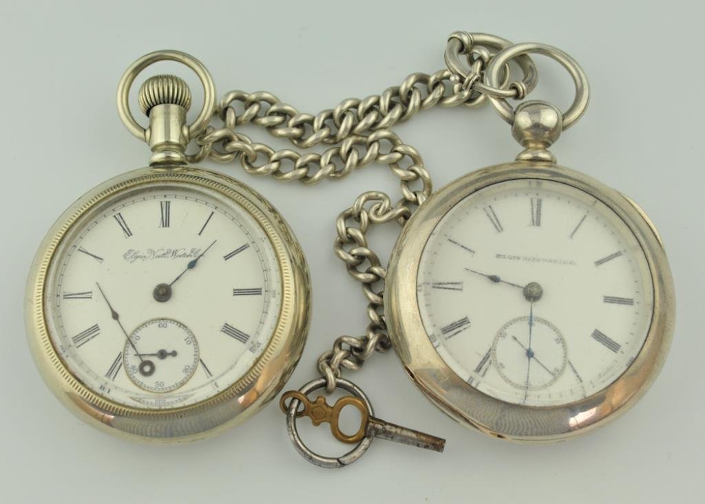 2 Elgin Pocket Watches--Coin Silver & Silverode: 1. Open face key wind pocket watch, white face marked "Elgin Natl Watch Co." and with Roman numerals, subsidiary seconds dial, case marked "Dueber Coin 182308", works marked "2013613", with chain and 