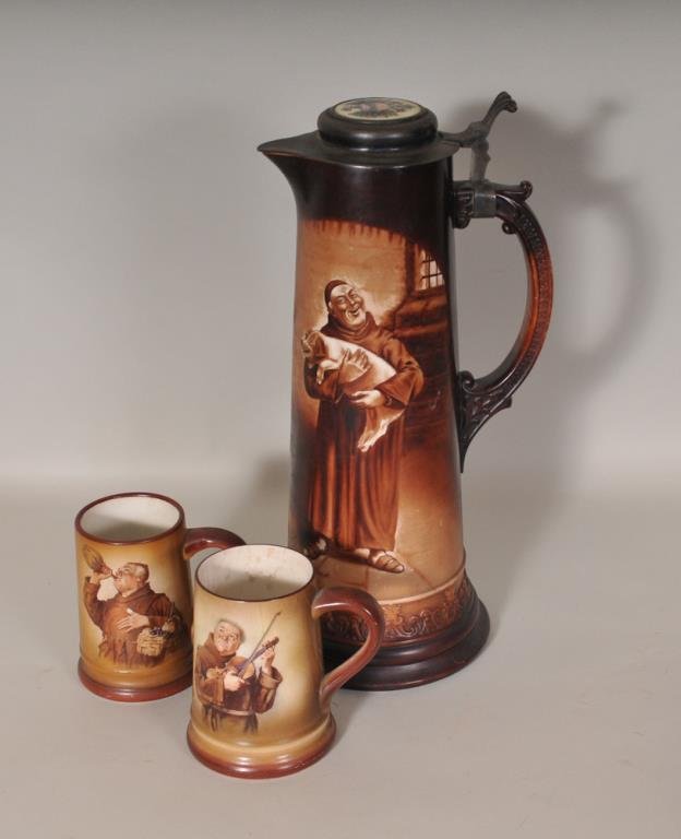Large O'Hara Dial Co. Tankard & Two Mugs: Tall hand painted ceramic tankard depicting a monk holding a pig, pewter hinged lid with thumb lift and ceramic insert depicting the Prussian Imperial eagle holding a shield reading "hoch!"; probably 