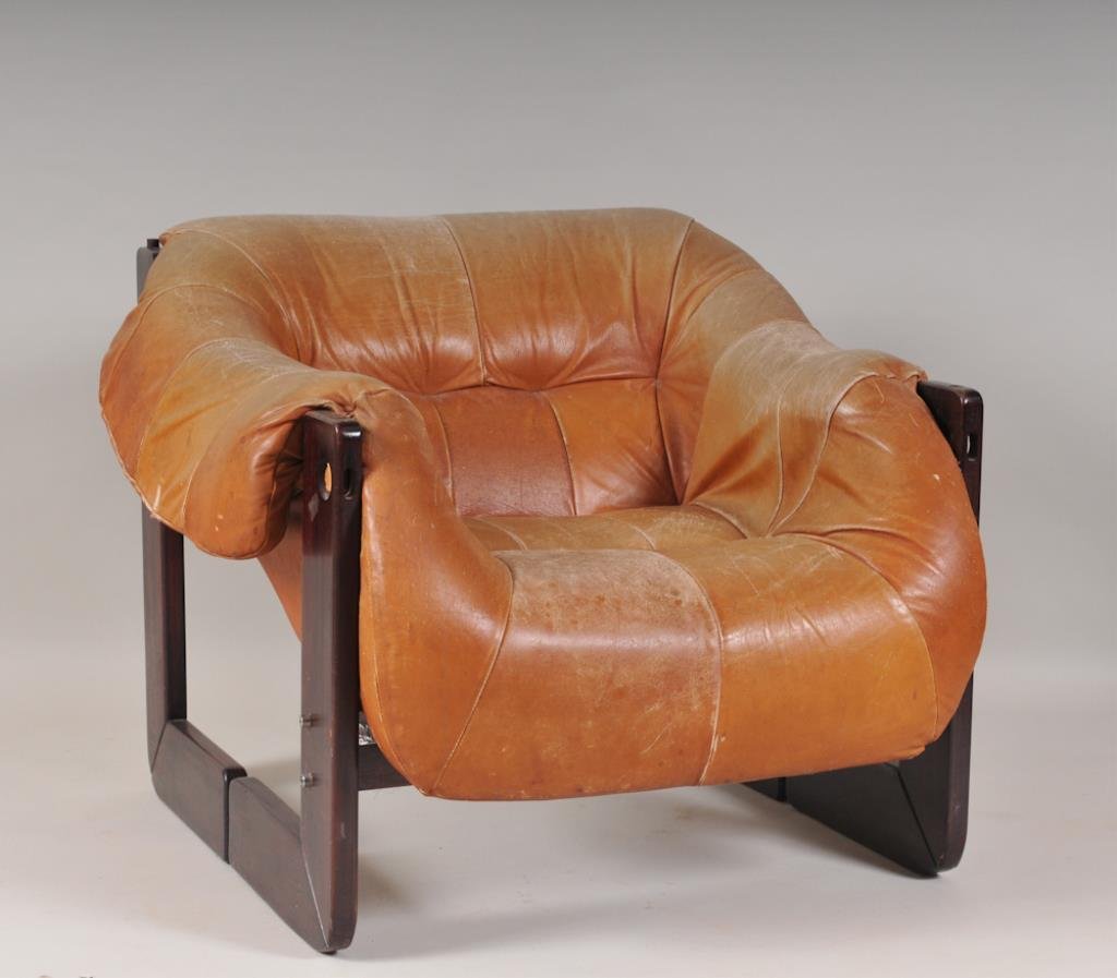 Percival Lafer Leather Lounge Chair: Mid-century modern lounge chair with Brazilian rosewood frame and cushioned tan leather seat and arm rests; Lafer label on bottom ; approx. 27 1/2"H, 31"W, 31"D with seat depth of 19", seat height 15"