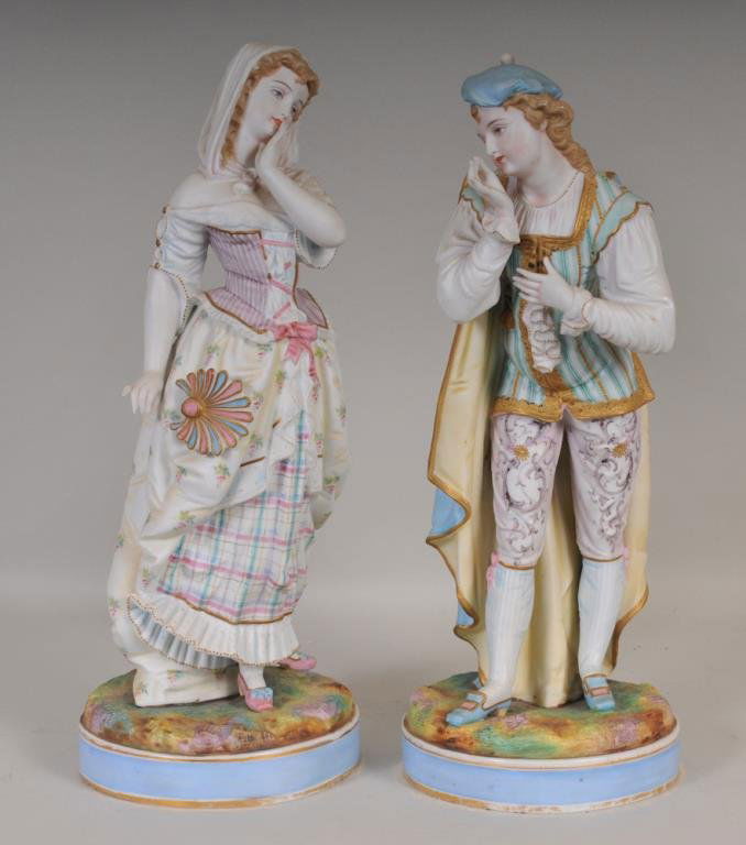 Pair of Large French Bisque Figures: Late 19th/early 20th century, probably French; intricately hand painted bisque figures of young man and woman, each with fanciful and detailed costumes; 17"H and 17 1/2"H; good condition overall, mino