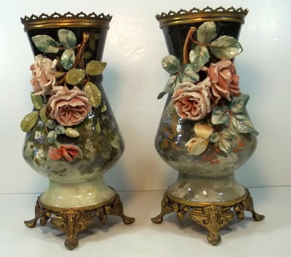 Pair of Emile Galle Faience Pottery Vases c1890: Raised molded, EG mark. Fitted with gilt metal mounts. Minor flakes and loss on flowers. Measures approx. 12" tall.