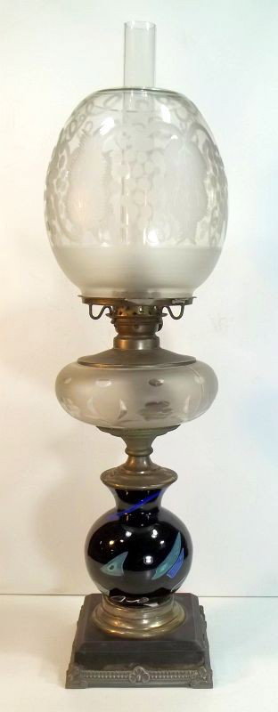 Mt. Washington Lava Glass Oil Lamp: Pairpoint lamp base made from a Mt. Washington Lava glass vase. Lava, also referred to as Sicilian Ware, was the first American art glass. It was patented by Frederick Shirley, the general manager of 