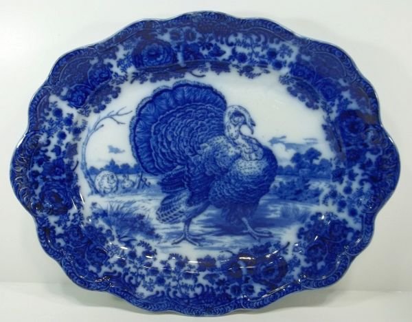 Flow Blue Staffordshire Platter "Tom Turkey": England, John Ridgeway. c1890. Measures approx. 20" x 15.75". Please Note: This one owner Flow Blue collection is generally in very good condition. However you must expect the imperfections and flaws