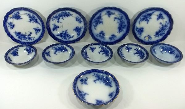 Flow Blue Staffordshire "Touraine" Lot: Henry Alcock & Co. and Stanley Pottery Co. England, "Touraine." c1900. (4) 9" plates, (5) 6" bowls, (1) 7.75" bowl. Please Note: This one owner Flow Blue collection is generally in very good condition