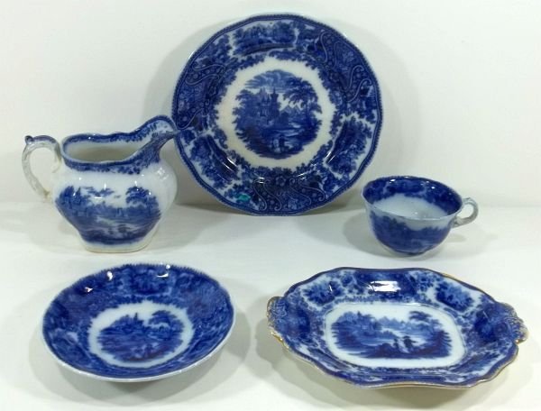 Flow Blue Staffordshire "Non Pariel" Lot: Middleport Pottery, England. "Non Pareil." c1890. Burgess & Leigh. Milk jug, tureen underplate, 8.75" plate and cup & saucer. Please Note: This one owner Flow Blue collection is generally in very good