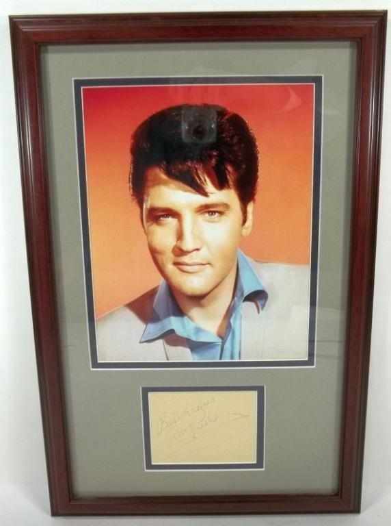 Elvis Presley Autograph: Cut signature with framed photo. Best Wishes Elvis Presley. Measures approx. 18.5" x 12.5".