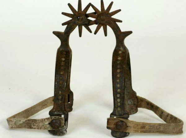 Pair of old Buermann daisy pattern spurs: Pair of old Buermann daisy pattern spurs with simple leather straps.