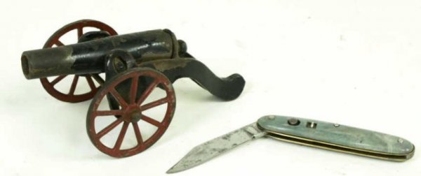 Cast iron firecracker cannon dated 1885 and: Cast iron firecracker cannon dated 1885 and Edgemaster automatic knife. 2" blade.