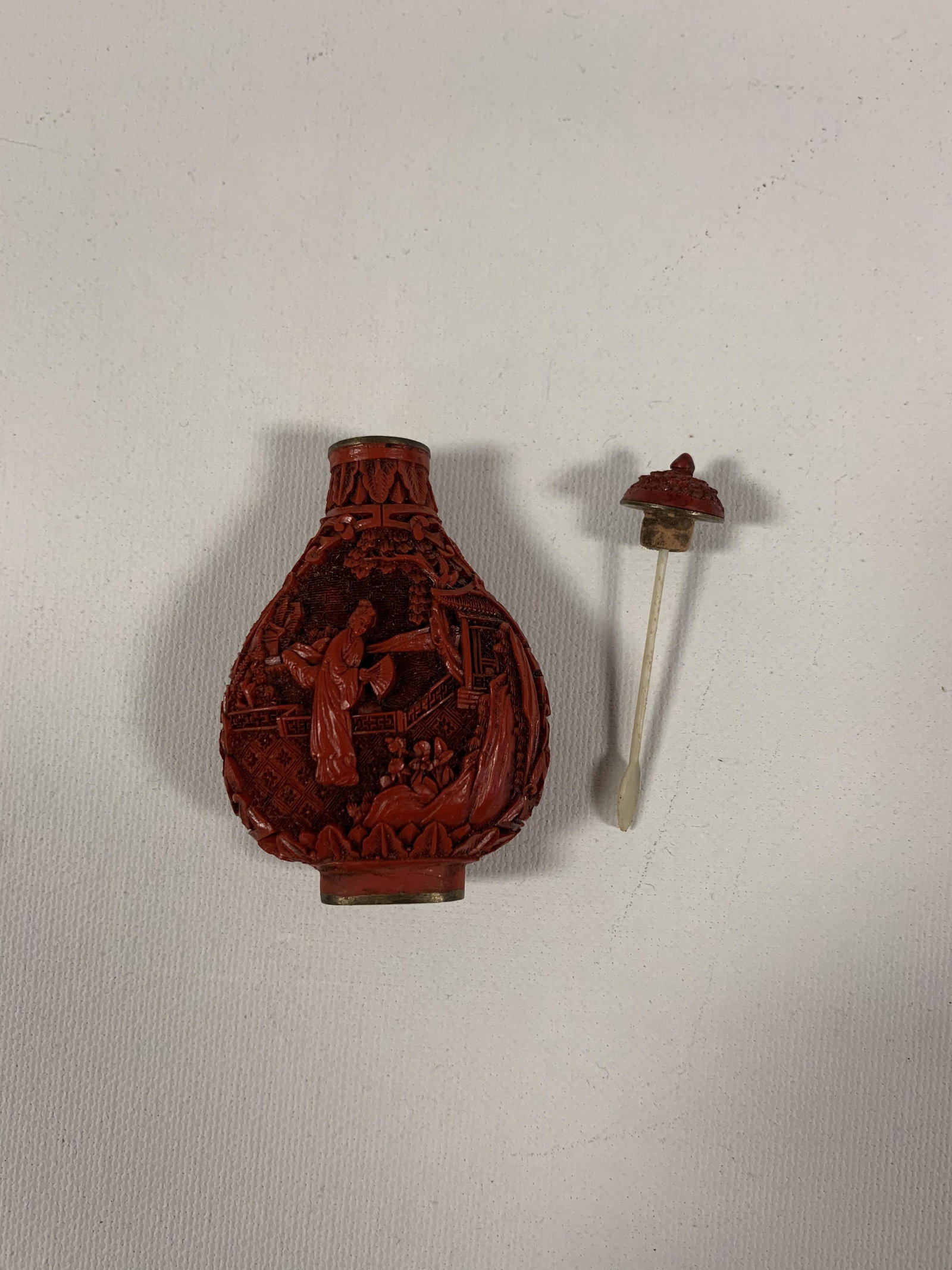 Quing Dynasty 1700's Cinnabar Snuff Bottle: Quing Dynasty 1700's Cinnabar Snuff Bottle Intricately carved Garden Scene/ Women Lid and spoon intact 2.25" H