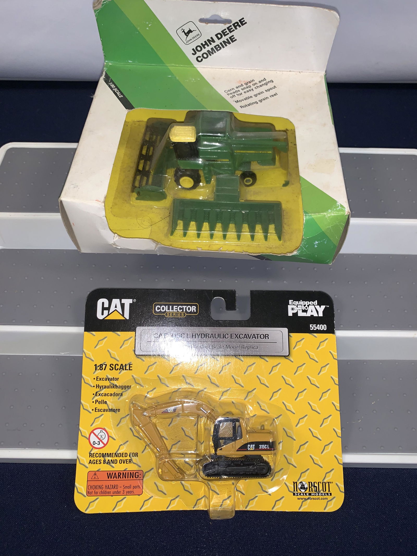 John Deere and Cat Figurines (1 of 1)