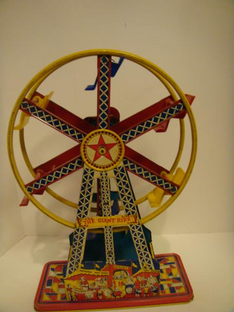 1950's Tin Wind Up Ferris Wheel Toy: The Giant Ride ferris wheel tin toy wind up. Approx 17" tall. condition is good and working.