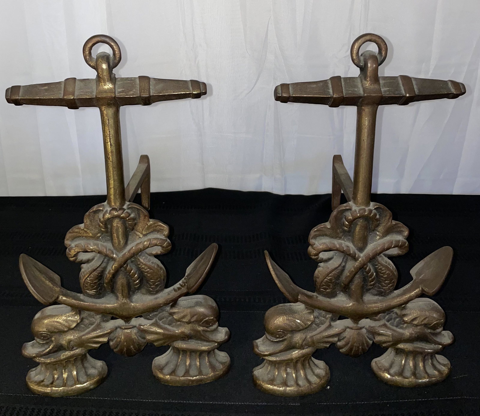 Anchor Fireplace Andirons: Anchor Motif Fireplace Andirons, 16.5” H x 10” W, 17.5” D, marked '142'on back, Each wrapped with a bundle of rope and twodolphins laying on scallop shell in betweencapstan feet