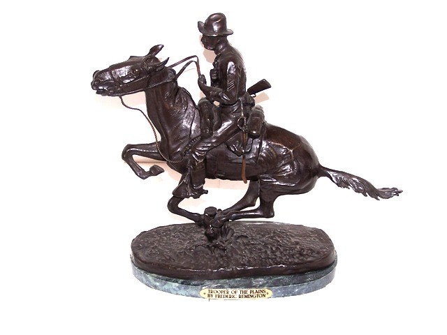 Frederic Remington Bronze Recast: "The Trooper of the Plains" bronze recast of the original Frederic Remington Sculpture. Approx 14' x 15' in size and mounted on a green marble base. Condition is very good.