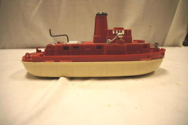Ideal Plastic Mechanical Tug Boat: Fire Fighter tug boat as is and in fair condition. Approx 14" long.
