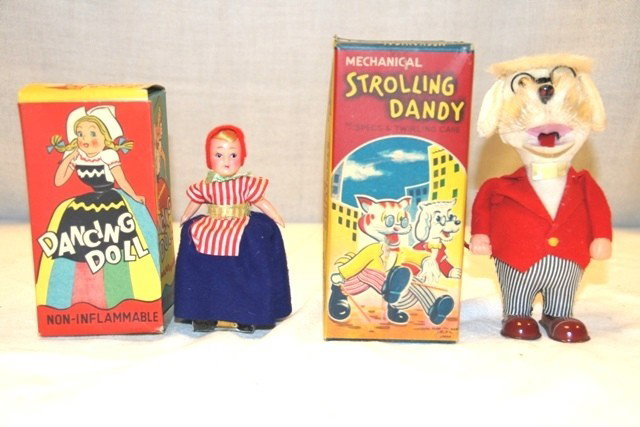 2 Mechanical Toy Dolls: Including Strolling Dandy and Dancing doll. Both in good condition is original boxes
