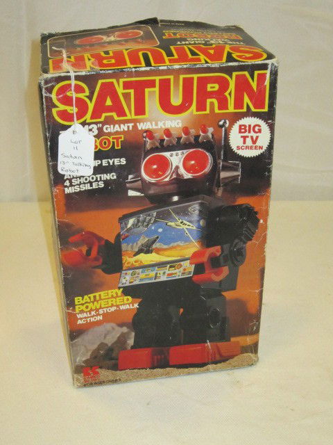 Saturn 13" Giant Walking Robot: Battery powered walking robot, with shooting missiles and lights. Original Box and in good condition. Some wear to box as shown.