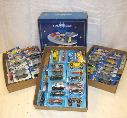 Hot Wheels Collection Lot: including 1993 tower and three flats of packaged hotwheels die casts.