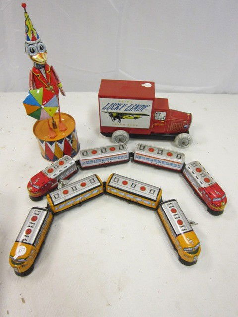 Collection of Tin Toys: Including 2 train wind ups, duck wind up with box… missing key left hand piece and a tin truck.