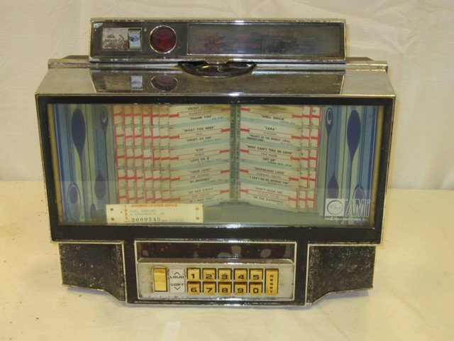 Rowe Diner Style Juke Box: Table top style Rowe AMI juke box. With chrome frame. Approx 20" x 14". Condition is as-is.
