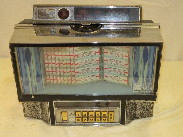 Rowe Diner Style Juke Box: Table top style Rowe AMI juke box. With chrome frame. Approx 20" x 14". Condition is as-is.