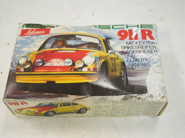 Schuco Porsche 911 Battery OP: Western Germany made battery OP toy in original box. Condition is very good. Apprx 10"