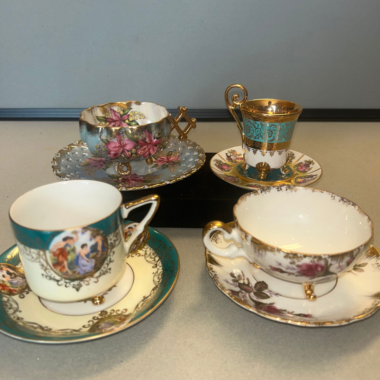 4 PORCELAIN FOOTED TEA CUPS AND SAUCERS: 4 PORCELAIN FOOTED TEA CUPS AND SAUCERS 1 PORZELLAN 2 ROYAL HAUSEY 1 UNMARKED