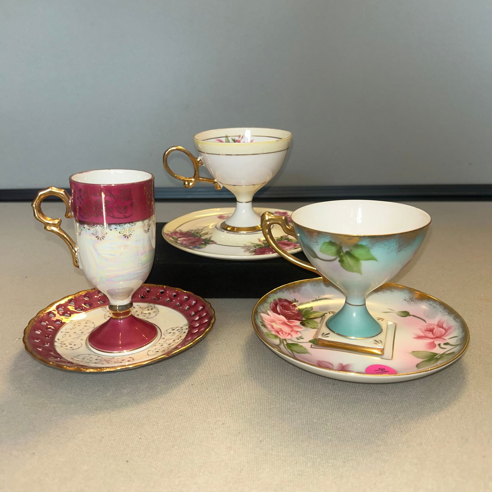3 PORCELAIN PEDESTAL FOOTED TEA CUPS AND SAUCERS: 3 PORCELAIN PEDESTAL FOOTED TEA CUPS AND SAUCERS