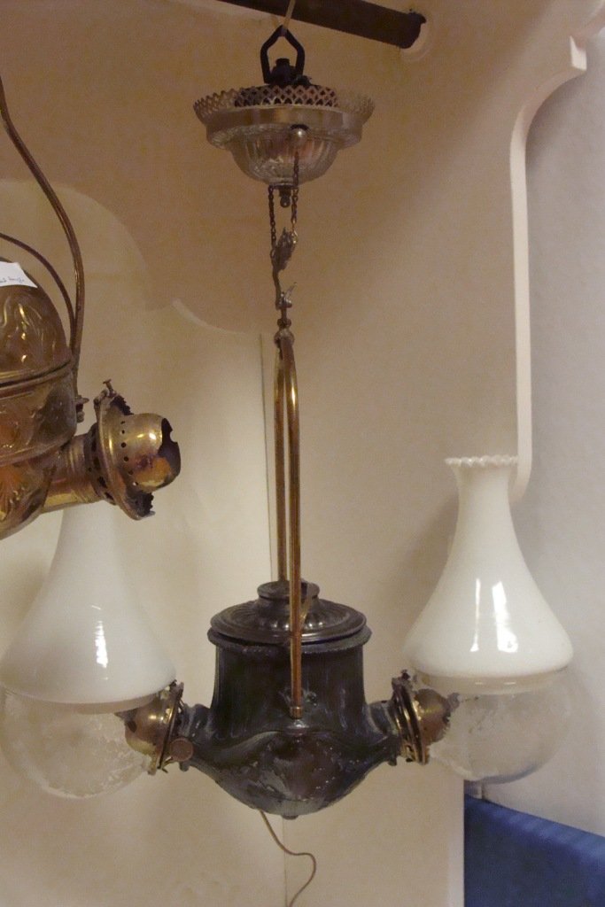 Hanging Dble Classic Angle Wall Lamp: Hanging Double Classic Style Angle Kerosene Lamp-crack repaired on side, 26"h, electrified, w' bird elbow globes & white chimney tops