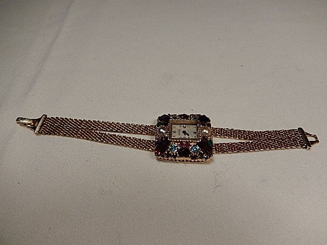 Ladies Lucien Piccard 14K Gold Watch w/ Various Stone S: 14K Gold wrist watch, mesh style band, 4 sm diamonds on dial, crystal glass style, stamped 14K, stones range from baguettes to rounds, squares cabochon and 2 pearls, watch & jewels weigh 26.9 dwt/41.8