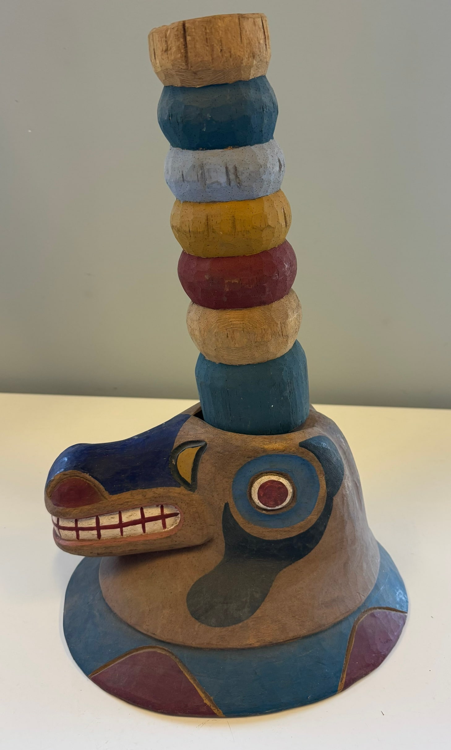 NORTHWEST COAST STYLE HELMET: HAND CARVED, WOLF CLAN CREST WITH REMOVABLE MULTI-RING POTLATCH.UNSIGNED, MID TO LATE 20TH CENTURYGREAT CONDITIONPROVENANCE: ESTATE OF DOUG DIVISH NORTH EAST OHIO