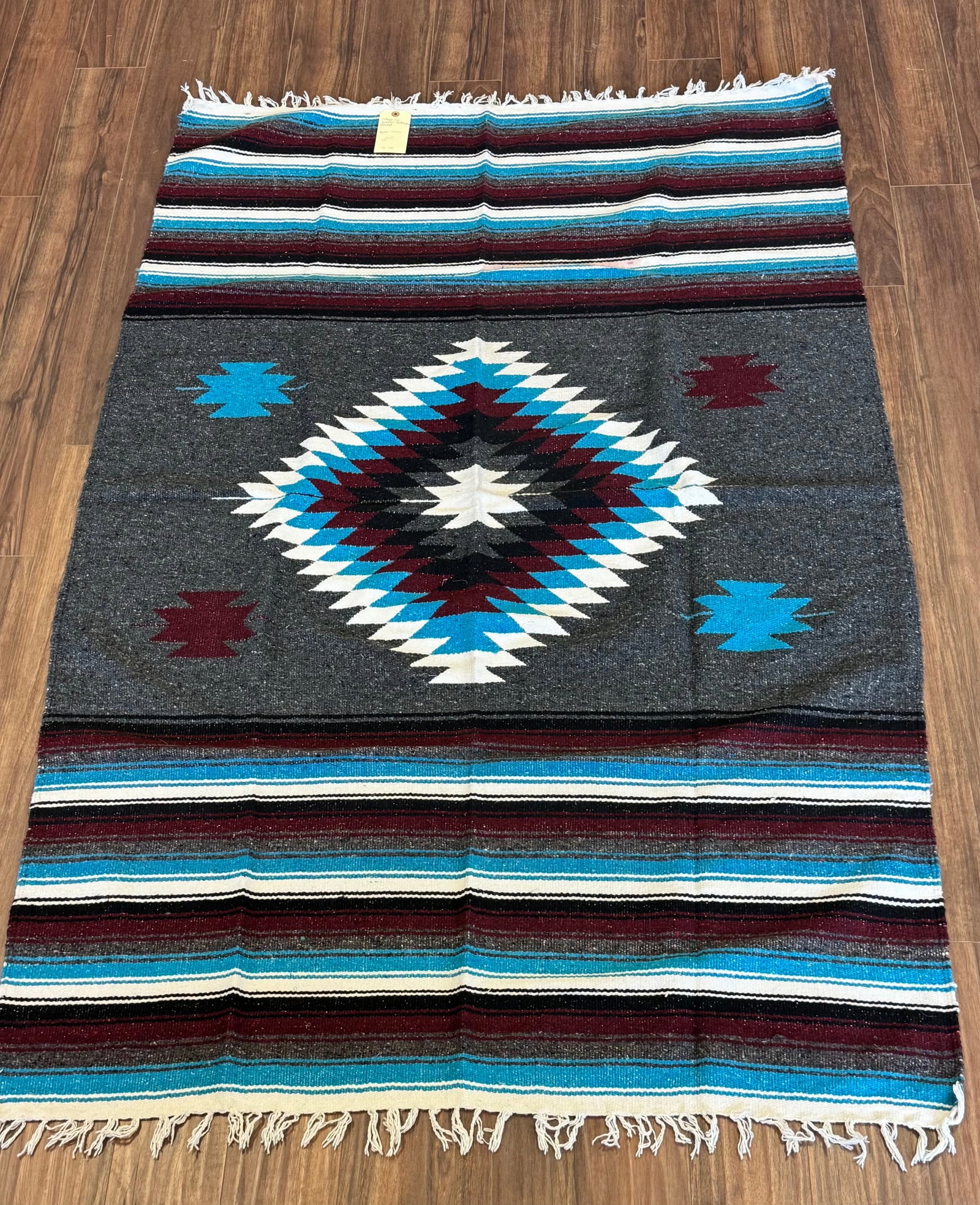 BOLD VINTAGE EYE DAZZLER SOUTHWESTERN BLANKET: APPROX: 79 X 51GREAT CONDITION, MILD STAINING ON WHITE SECTION FROM THE RED INK OF THE ACTUAL RUG. PROVENANCE: ESTATE OF DOUG DIVISH NORTH EAST OHIO
