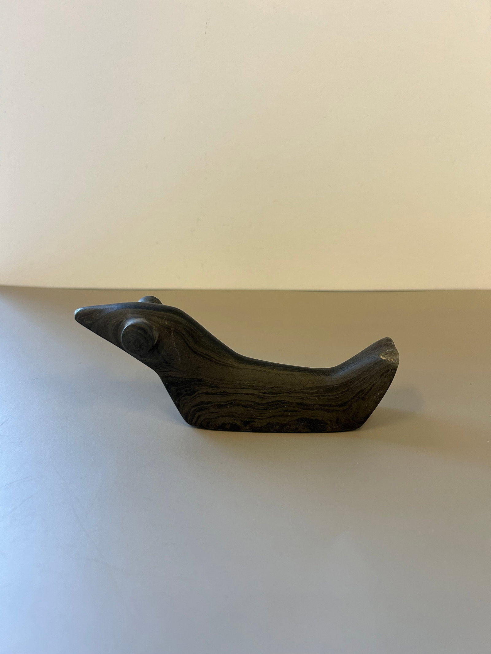 LATE ARCHAIC STYLE "POP EYED" BIRDSTONE: ORIGIN: LABELED "ALLEN COUNTY, INDIANA"DIMENSIONS: APPROX 5" X 2"VINTAGE INVENTORY CARD: "SLATE POP EYED BIRD STONE / ALLEN CO., INDIANA / GORDON HUNT COLLECTION"AN ATTRACTIVE "POP EYED BIRDSTONE