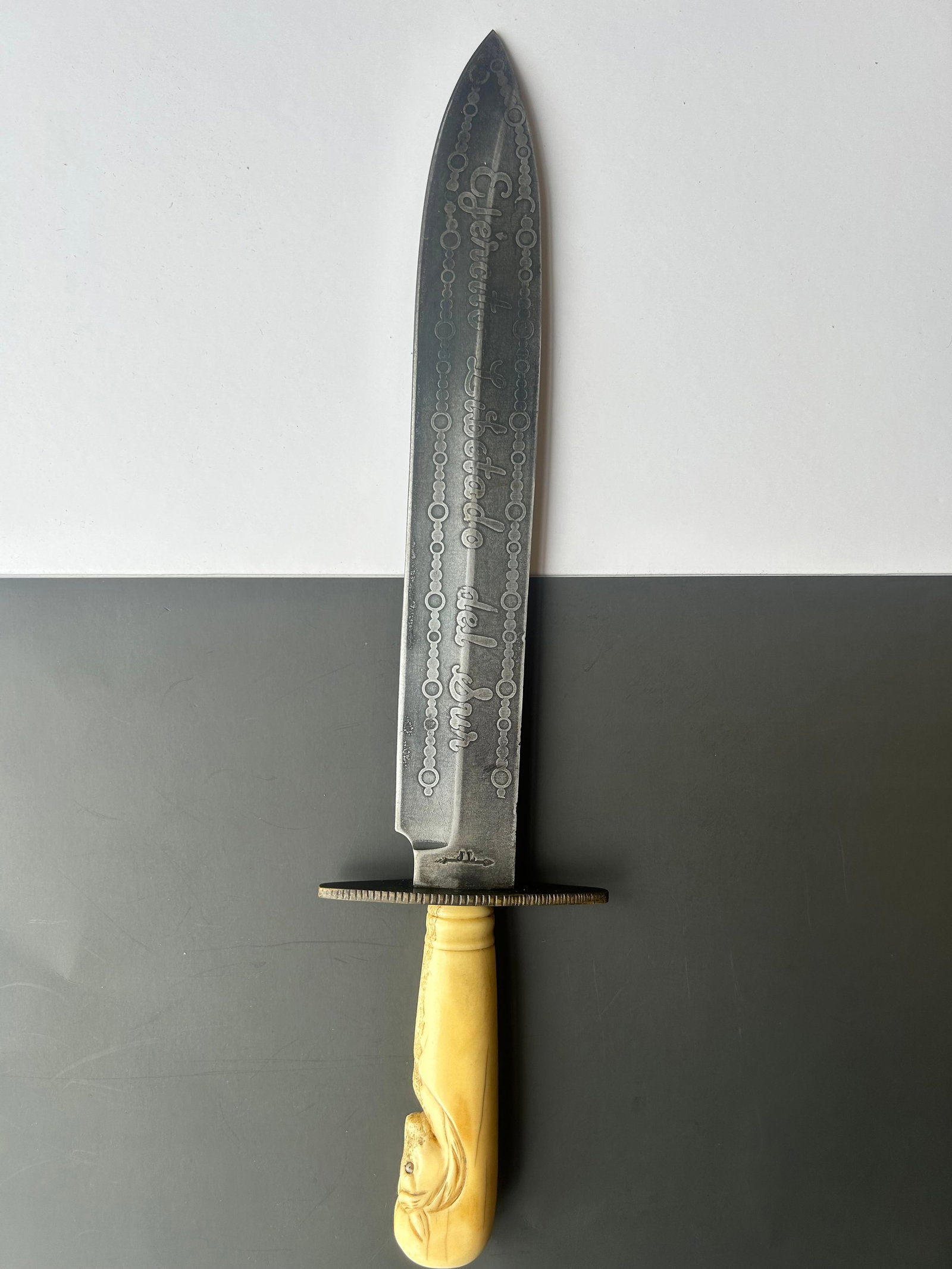 EMILIANO ZAPATA BONE HANDLED BOWIE KNIFE: EMILIANO ZAPATA BONE HANDLED BOWIE KNIFE, HANDLE IS OF A HORSE, ONE SIDE 'EMILIANO ZAPATA 1910' OTHER SIDE 'EJERCITO LIBETADO DEL SUR, FLORAL DESIGNS THROUGHOUT, LATE 19TH EARLY 20TH CENTURY, 14.5'' L