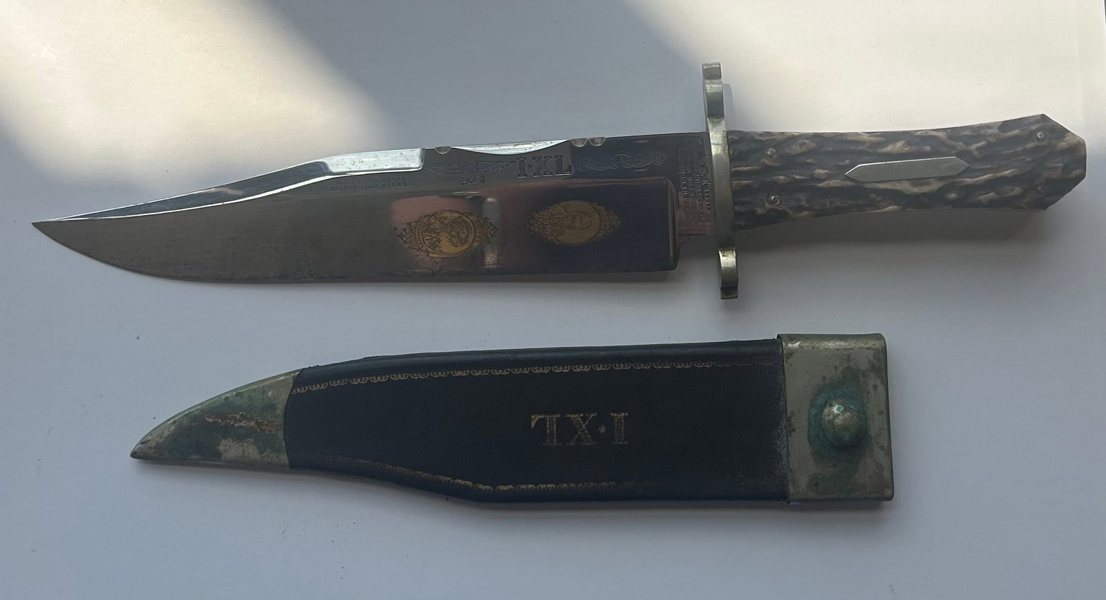 G. WOSTENHOLM & SON BOWIE KNIFE IXL: G. WOSTENHOLM & SON BOWIE KNIFE AND SHEATH, IXL, HAS GEN.GARIBALDI AND VICTOR EMMANUAL PORTRAITS ON THE BLADE, STAG HANDLE, PROVENANCE: ESTATE OF DOUG DIVISH, NORTHEAST OHIO