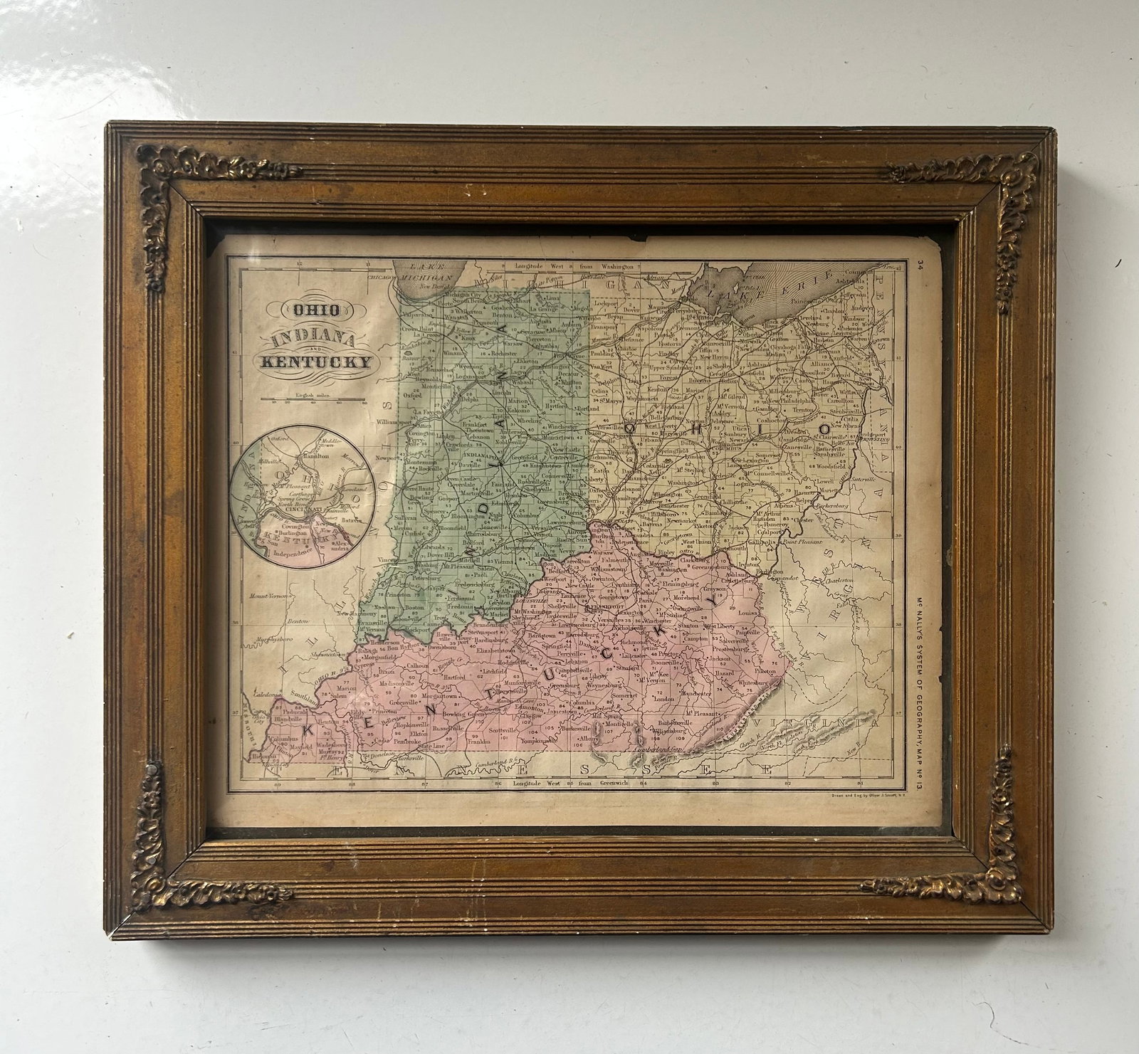 1871 MCNALLY'S GEOGRAPHY MAP OH, IN, KY, FRAMED: 19TH CENTURY ATLAS MAP TITLED "OHIO, INDIANA, AND KENTUCKY" FROM MCNALLY'S SYSTEM OF GEOGRAPHY, MAP NO. 13. DRAWN AND ENG. BY OLIVER J. STUART, N.Y. HOUSED IN AN ANTIQUE DECORATIVE FRAME. DISPLAYS