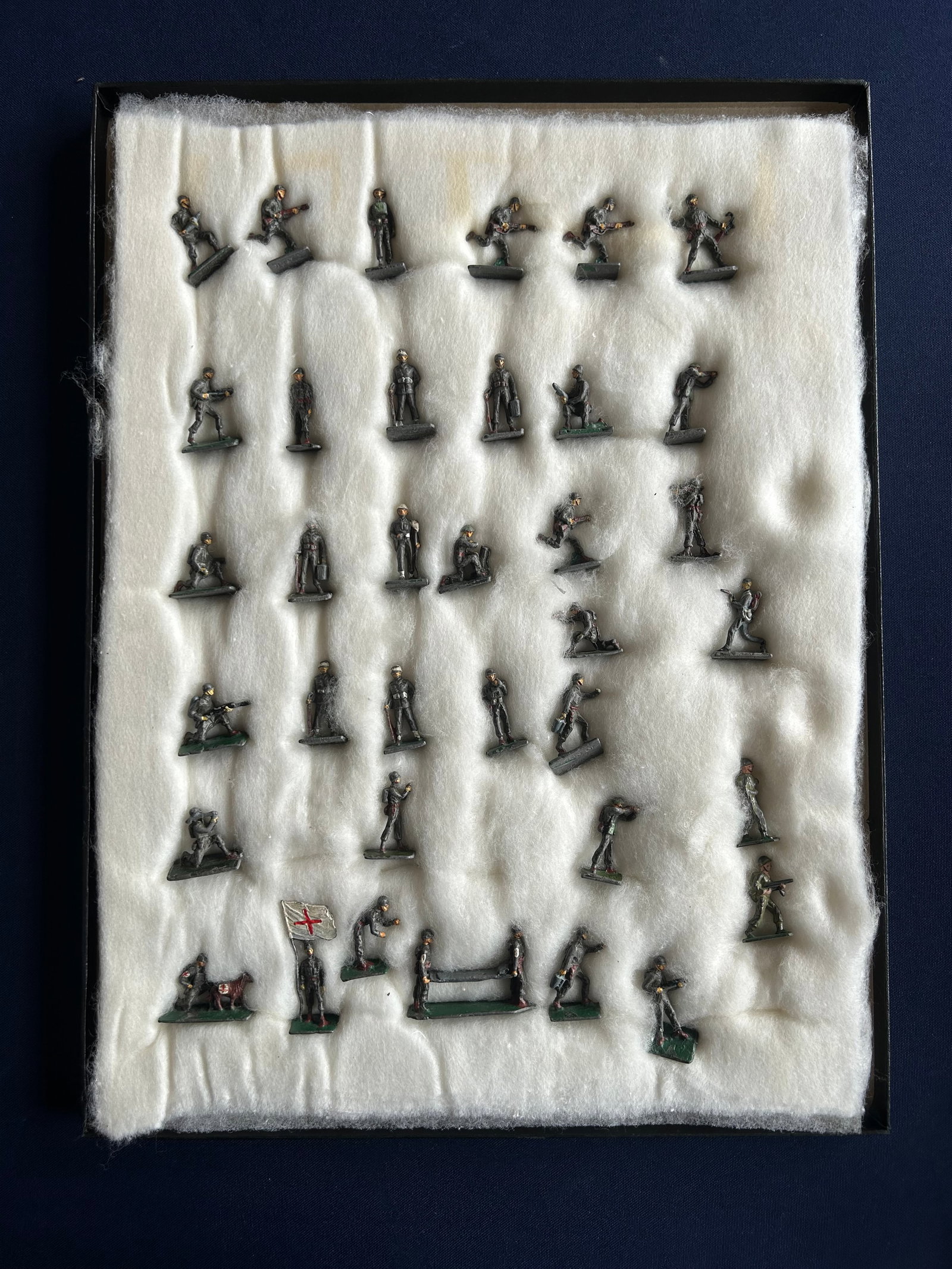 36 SAE UNION OF SOUTH AFRICA LEAD SOLDIERS: STRIKING COLLECTION OF 36 VINTAGE HAND PAINTED LEAD MILITARY MINIATURES, WITH BASES MARKED " UNION OF SOUTH AFRICA." THE LOT FEATURES AN IMPRESSIVE VARIETY OF WWII STYLE FIGURES IN ACTION AND SUPPORT 