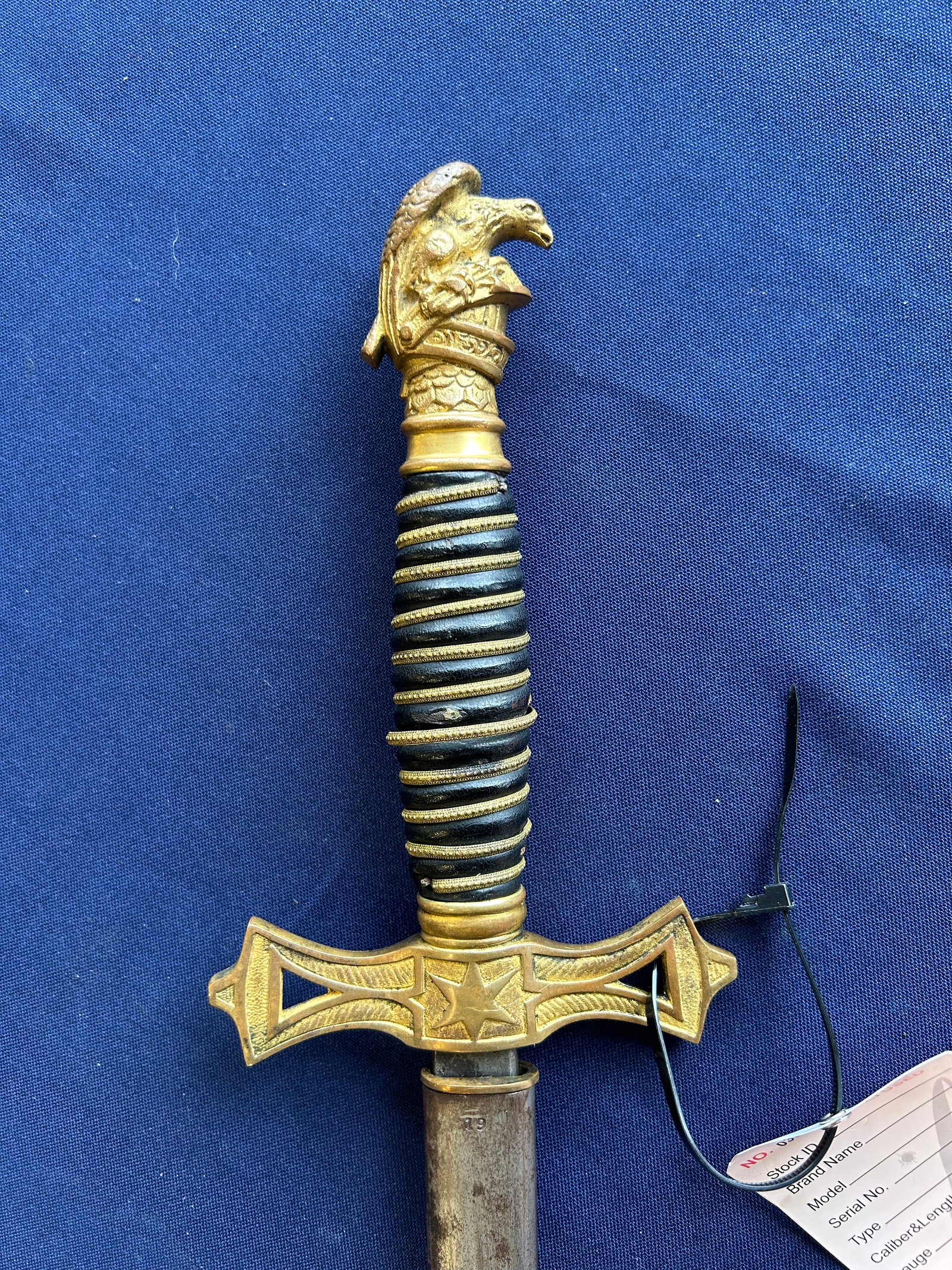 ANTIQUE C.B.K.A. FRATERNAL SWORD: LATE 19TH TO EARLY 20TH CENTURY CATHOLIC BENEVOLENT KNIGHTS OF AMERICA FRATERNAL SWORD, RETAILED BY J.W. VICKERS OF BUFFALO, NEW YORK. FEATURES AND ORNATE GILT FINISHED OPENWORK GUARD MARKED C.B.K.A. 