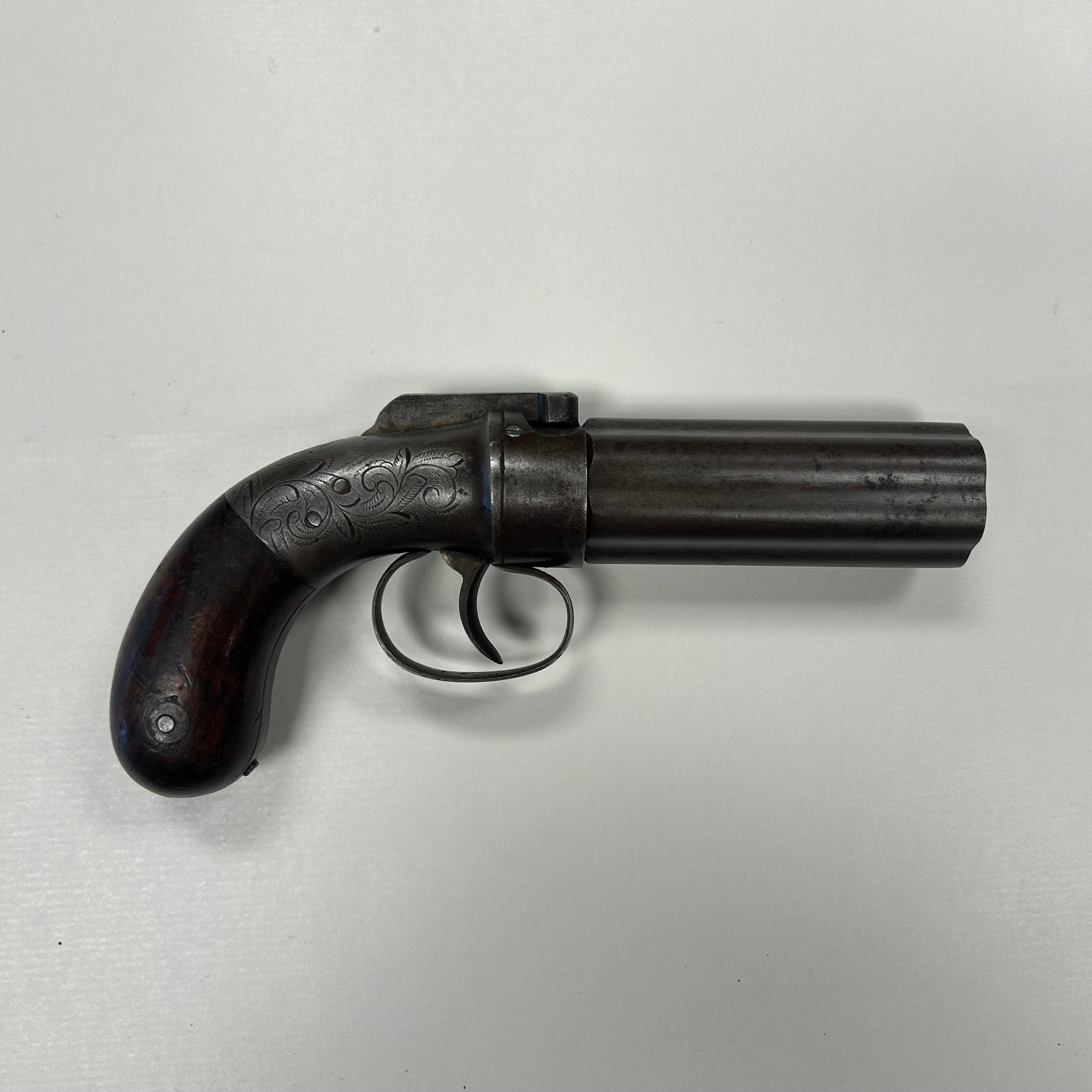 MANHATTAN .28 CAL PEPPERBOX SERIAL NO. 70: DESIRABLE EARLY MANHATTAN FIRE ARMS MFG. CO. SIX SHOT PERCUSSION PEPPERBOX IN .28 CALIBER, CIRCA 1850s. FEATURES A SIX BARREL CLUSTER MARKED "CAST STEEL", FINELY SCROLL ENGRAVED FRAME, WALNUT GRIPS AN