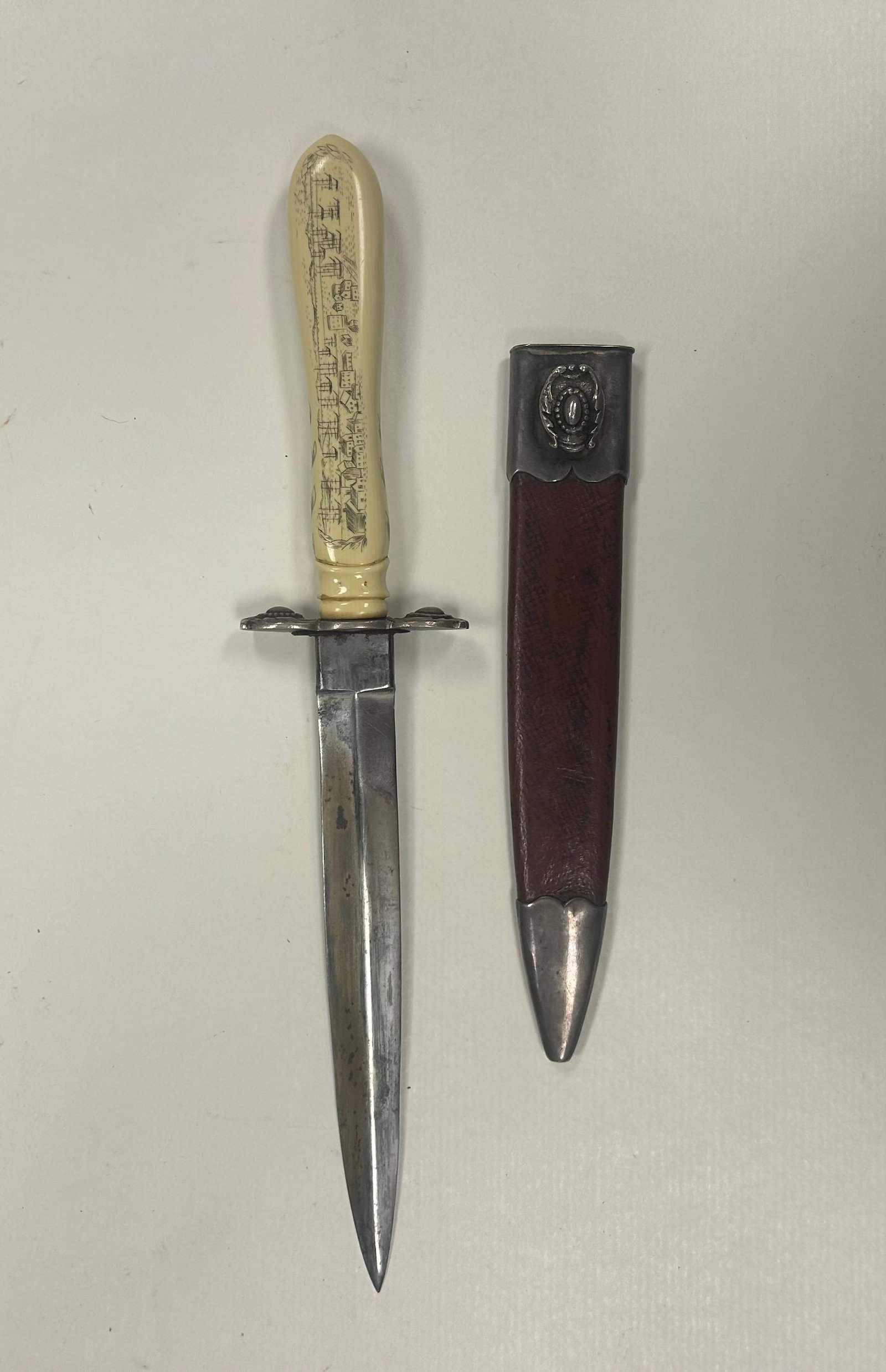 M. PRICE SAN FRANCISCO PICTORIAL DIRK KNIFE: M. PRICE SAN FRANCISCO MARKED DIRK KNIFE WITH APPROX. 6 INCH BLADE AND FINELY ENGRAVED HANDLE DEPICTING A SAN FRANCISCO WATERFRONT SCENE, INSCRIBED "SAN FRANCISCO. 1860." INCULDES FITTED LEATHER AND M