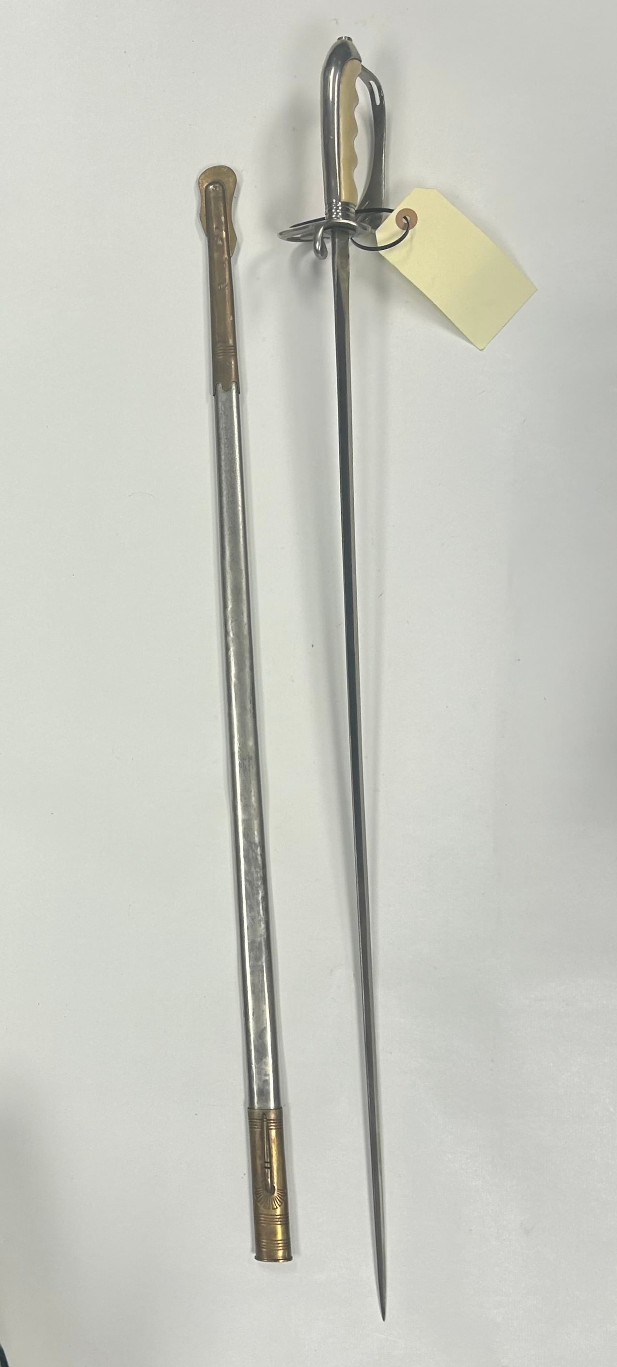 U.S. MODEL 1902 ARMY OFFICER'S SABER: U.S. MODEL 1902 ARMY OFFICER'S SABER, GERMAN MADE AND RETAILED BY AMERICAN SUPPLY CORP., NEW YORK. APPROX. 32" PLAIN BLADE WITH LIGHT COLORED GRIP AND METAL SCABBARD. SHOWS AGE RELATED WEAR, PATINA AN