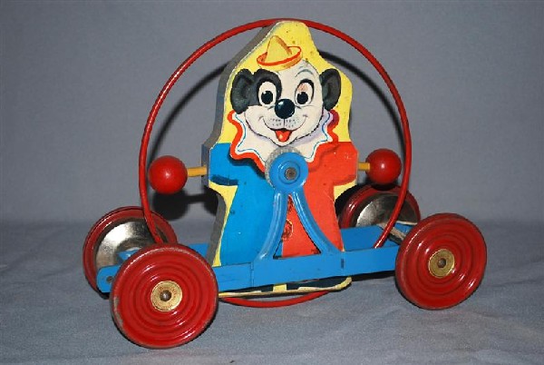 Clown Pull Toy by The Gong Bell Mfg. CO. metal and: Clown Pull Toy by The Gong Bell Mfg. CO. metal and wood, 12 inches long,