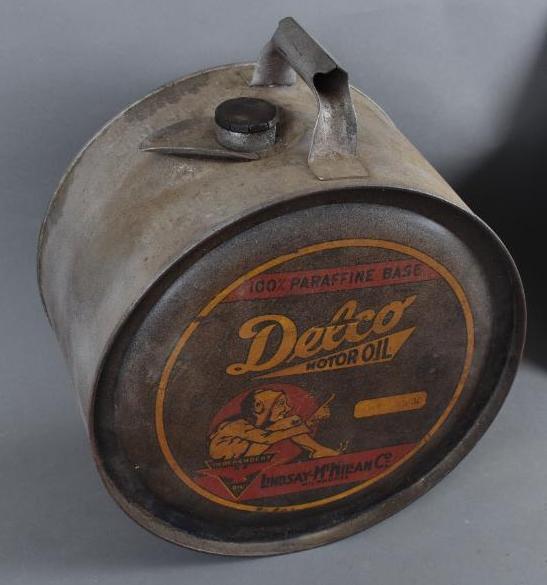 Delco Motor Oil Five Gallon Rocker Can: rated 6.75, five gallon metal rocker can has heavy wear and scartches, is empty.