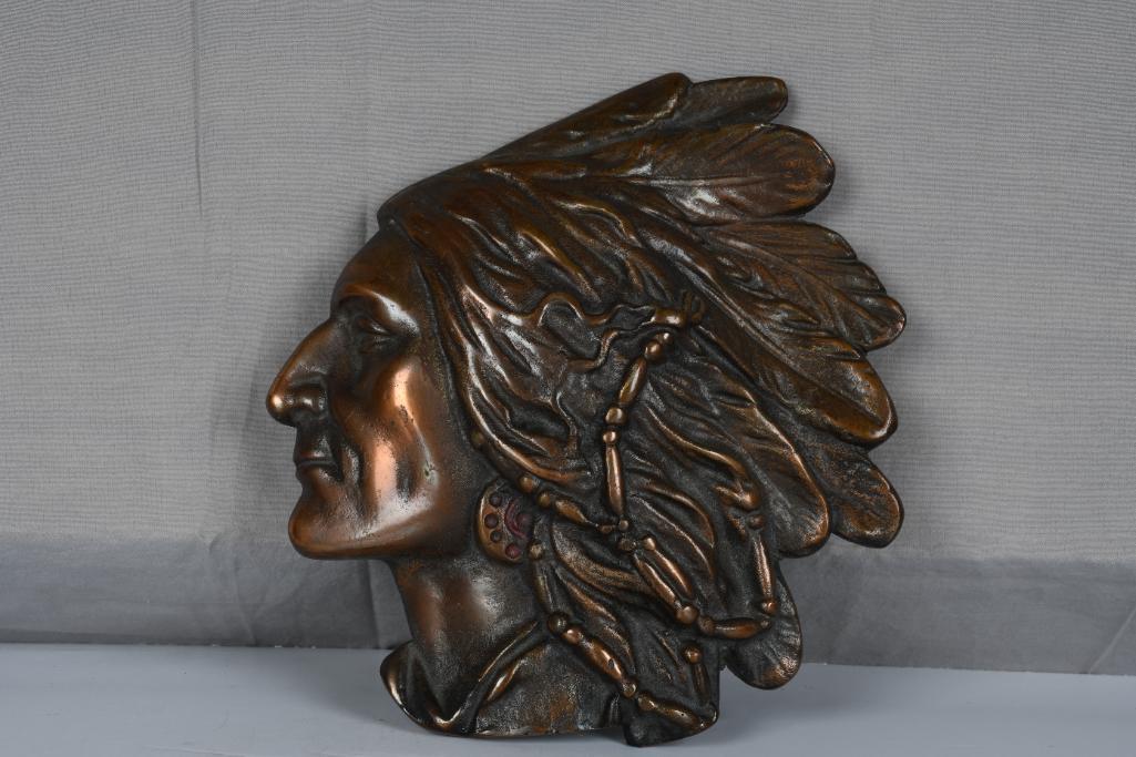 Cast Iron Indian Profile a Christmas Give-a-way: rated 9, 10"x9"., cast iron Indian profile, has a brass finish, has not been cold painted, is missing its disc.